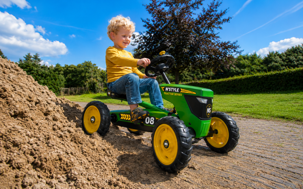 Happy ride on a green tractor